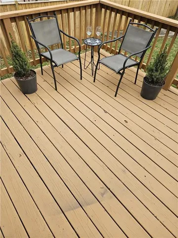 a living room with a mirror and a potted plant