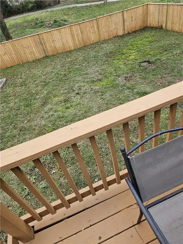 a spacious bathroom with a double vanity sink a mirror and a toilet