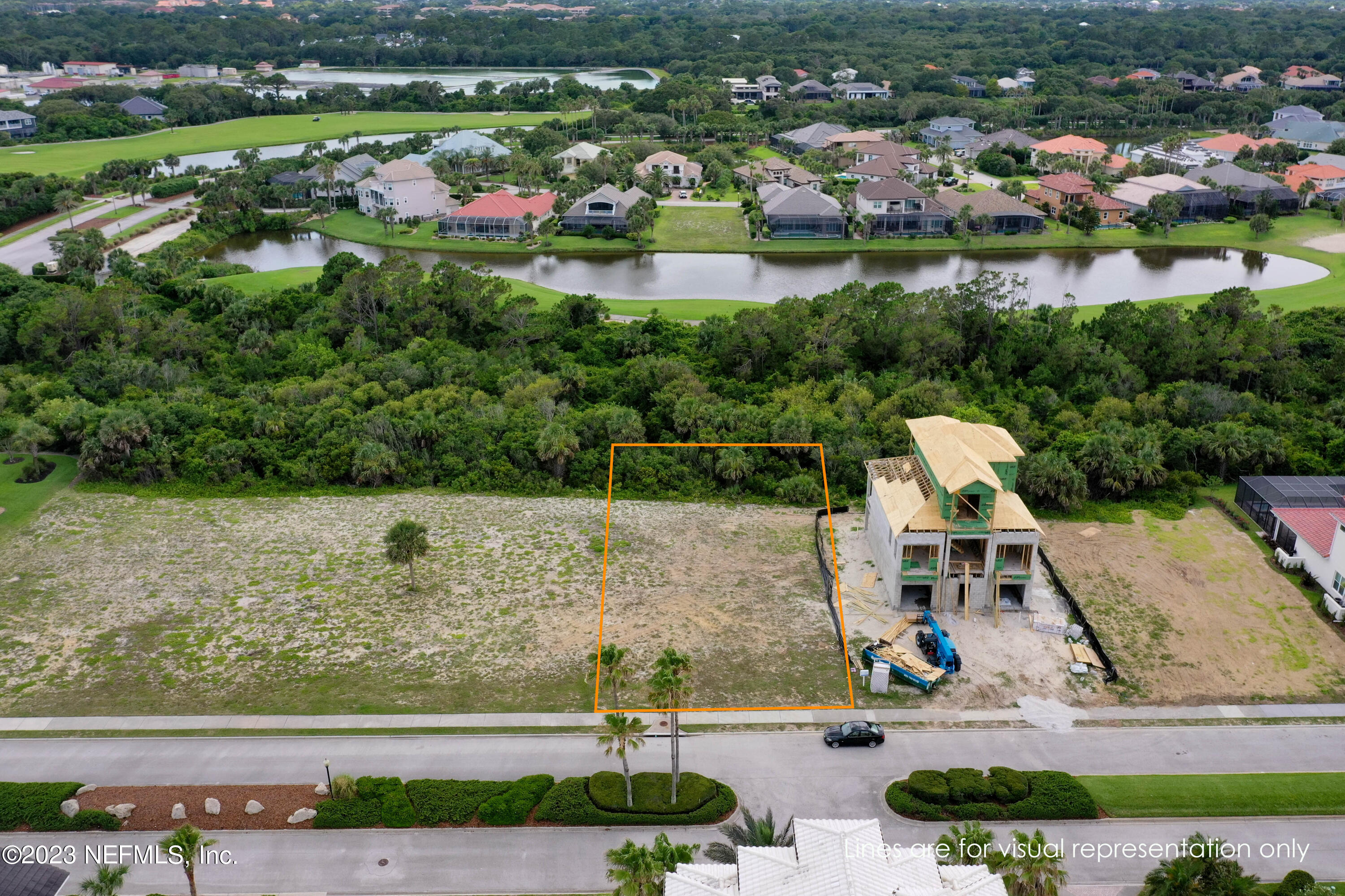 11 Ocean Ridge Boulevard Palm Coast, FL 32137 - Photo 11 of 41 an aerial view of a house with a yard and lake