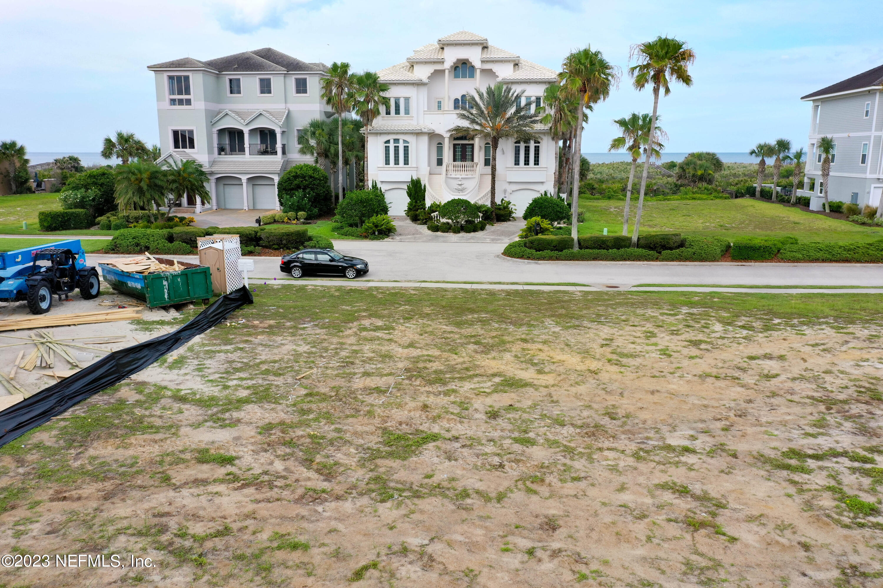 11 Ocean Ridge Boulevard Palm Coast, FL 32137 - Photo 19 of 41 a view of swimming pool with outdoor seating and trees in the background