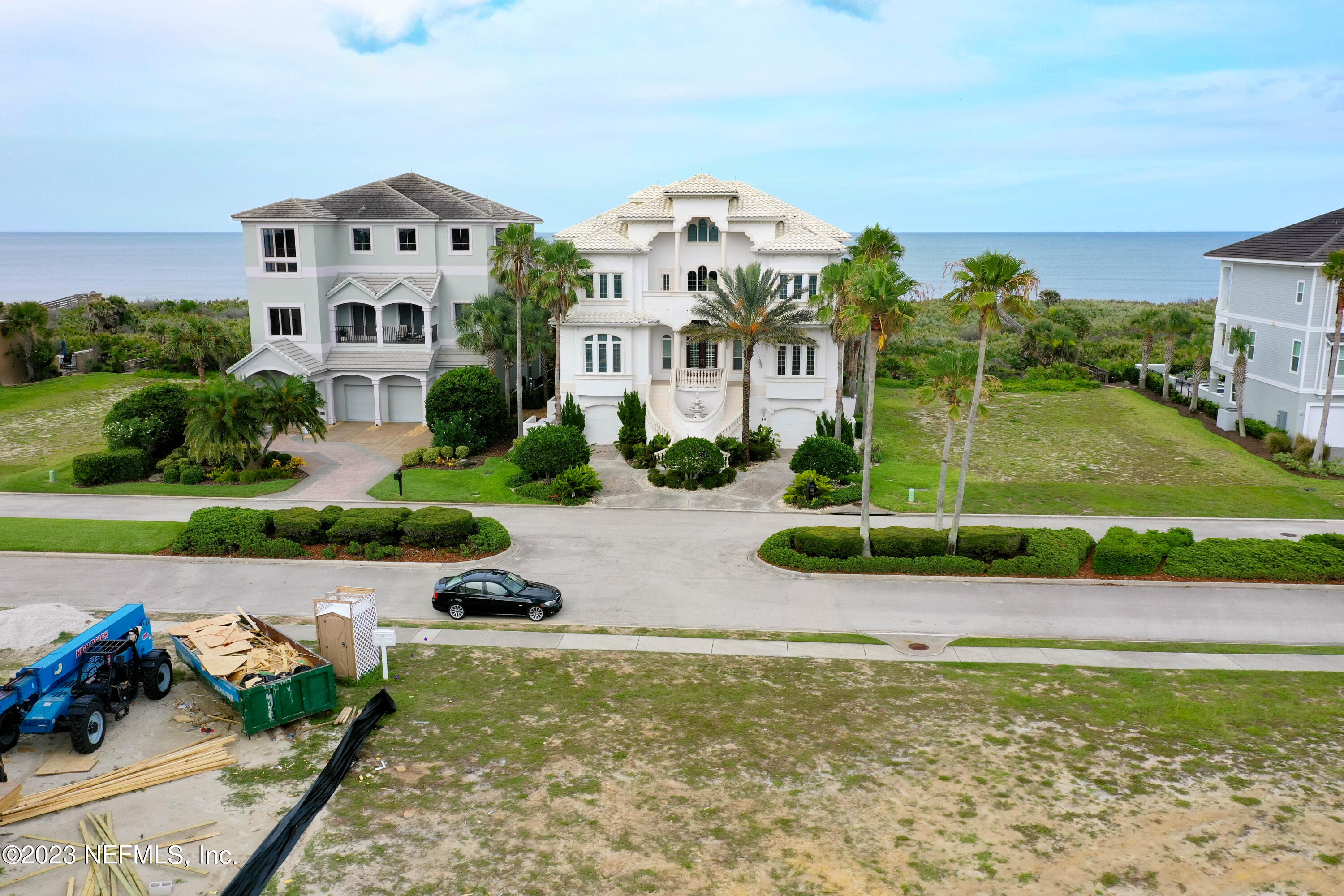 11 Ocean Ridge Boulevard Palm Coast, FL 32137 - Photo 21 of 41 a front view of a house with a yard and potted plants