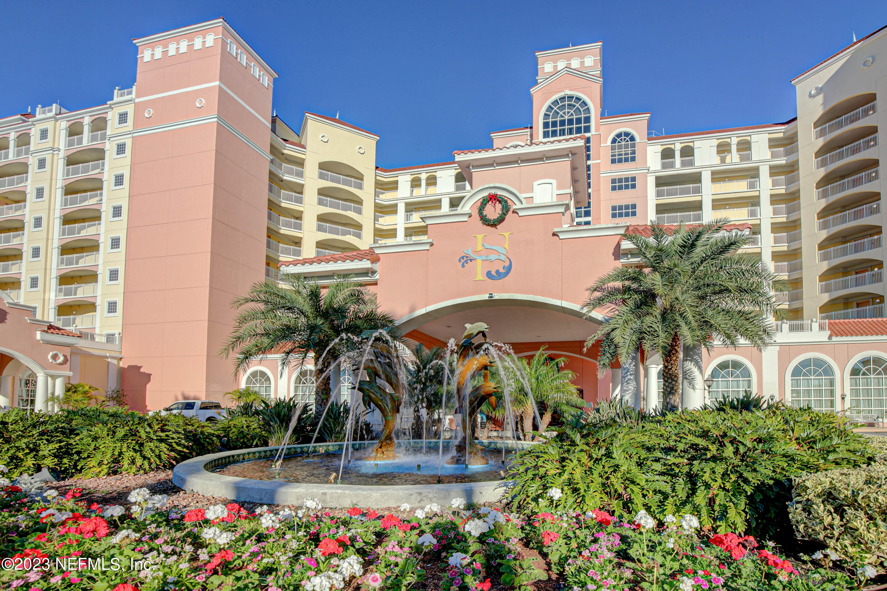 11 Ocean Ridge Boulevard Palm Coast, FL 32137 - Photo 35 of 41 front view of a building with potted plants