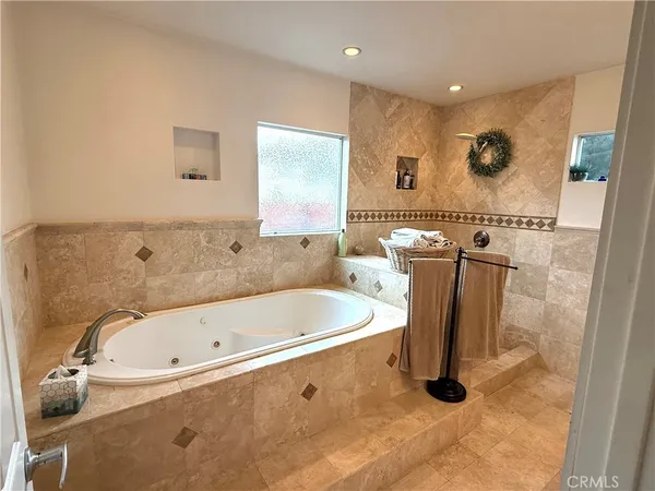 a bathroom with a bathtub and a shower