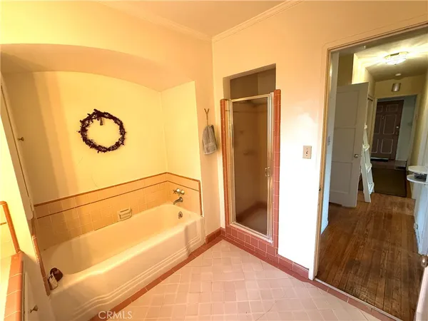a bathroom with a tub and shower