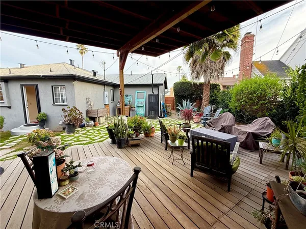 a view of outdoor kitchen with seating area