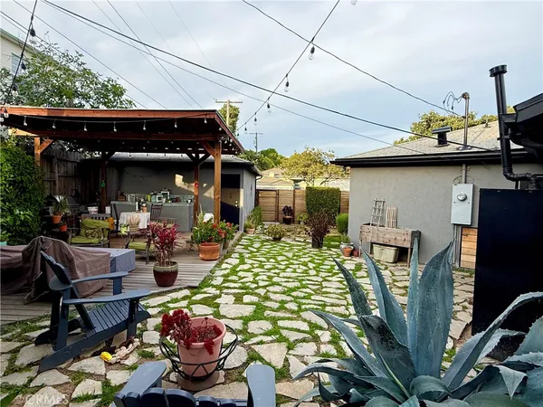 a outdoor living space with furniture and a fireplace