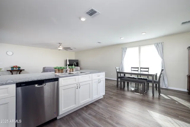 a bedroom with a bed and a ceiling fan