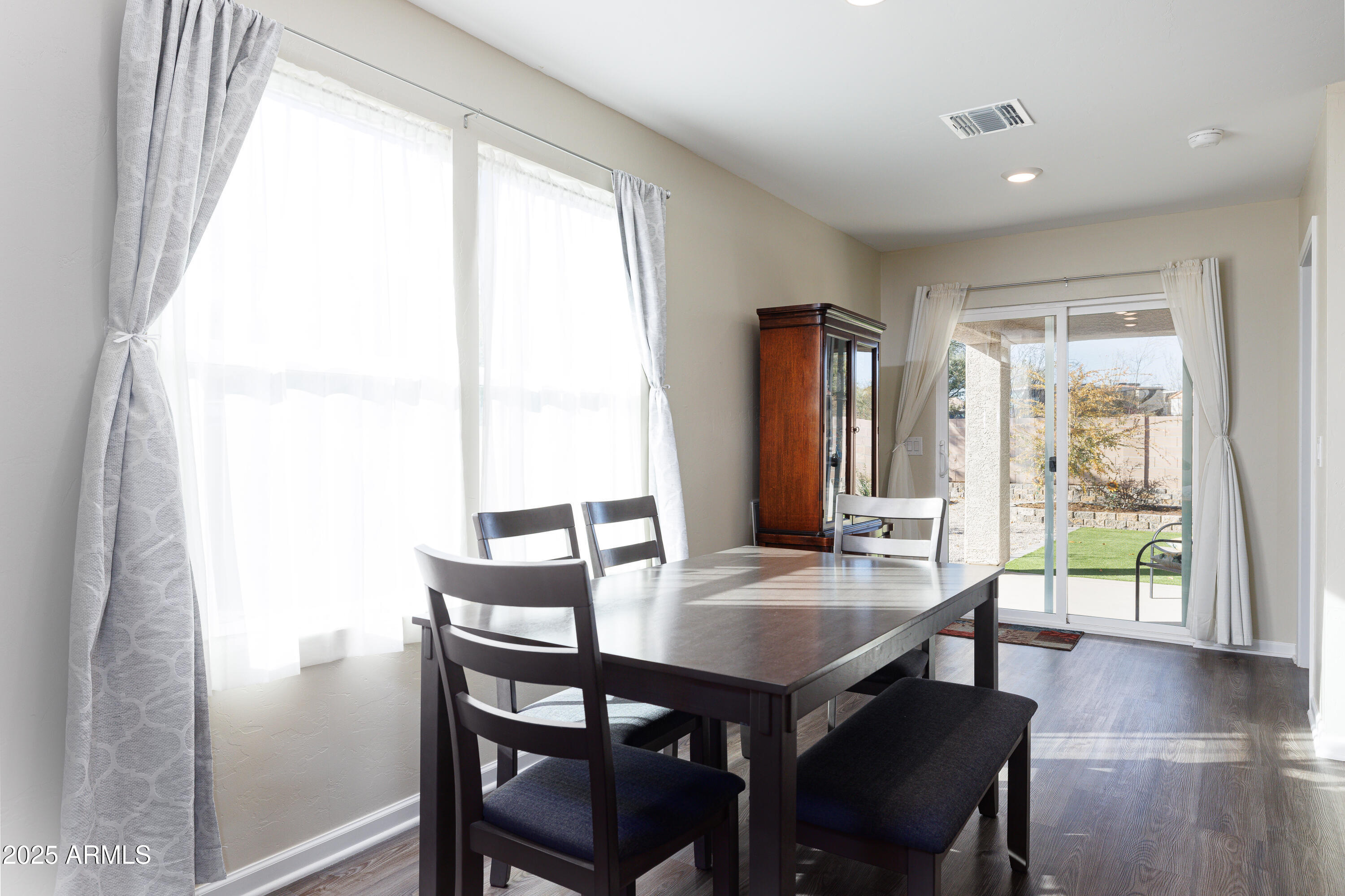 1256 South Lenora Loop Benson, AZ 85602 - Photo 15 of 34 a view of a dining room with furniture and wooden floor