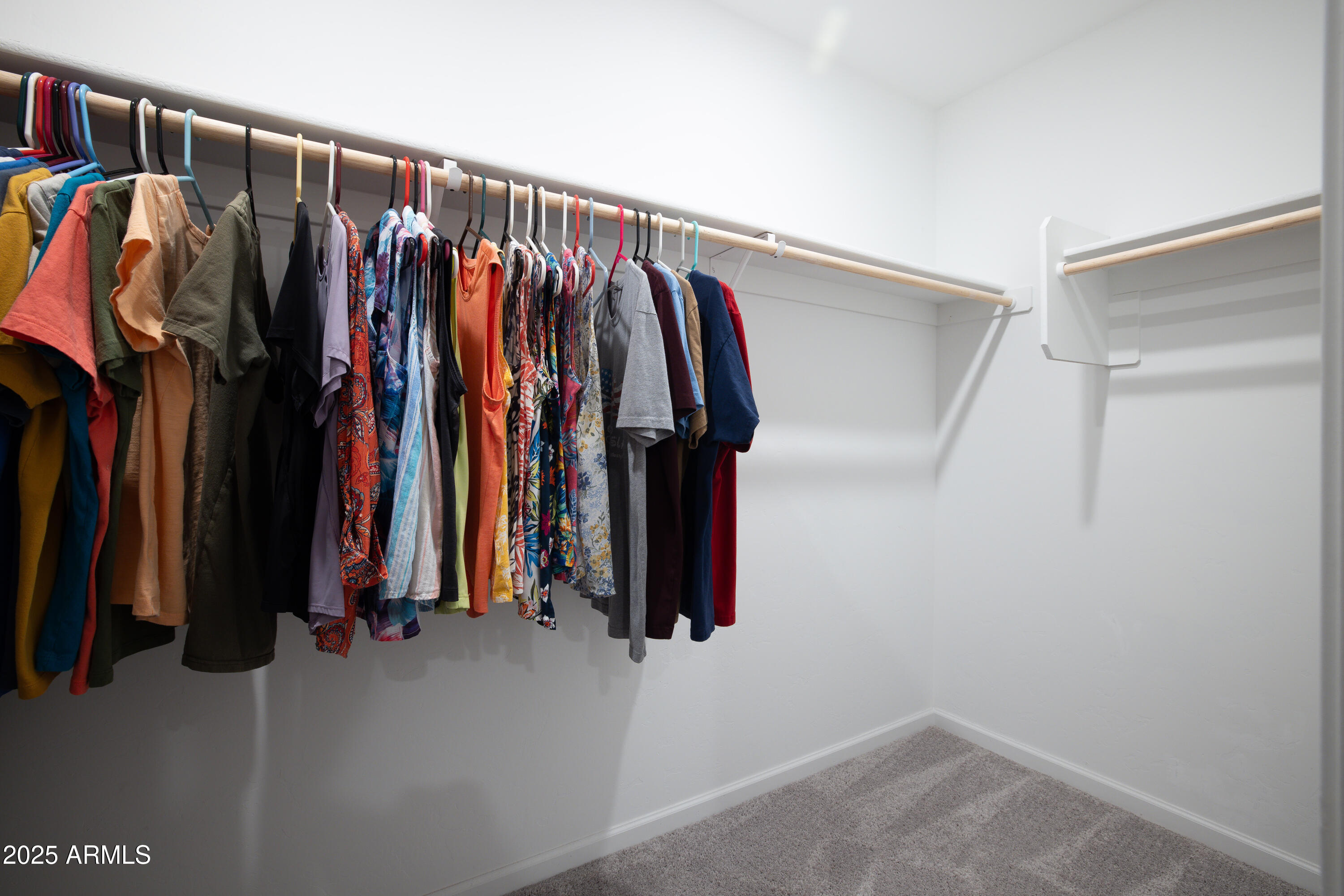 1256 South Lenora Loop Benson, AZ 85602 - Photo 22 of 34 a view of walk in closet with clothes