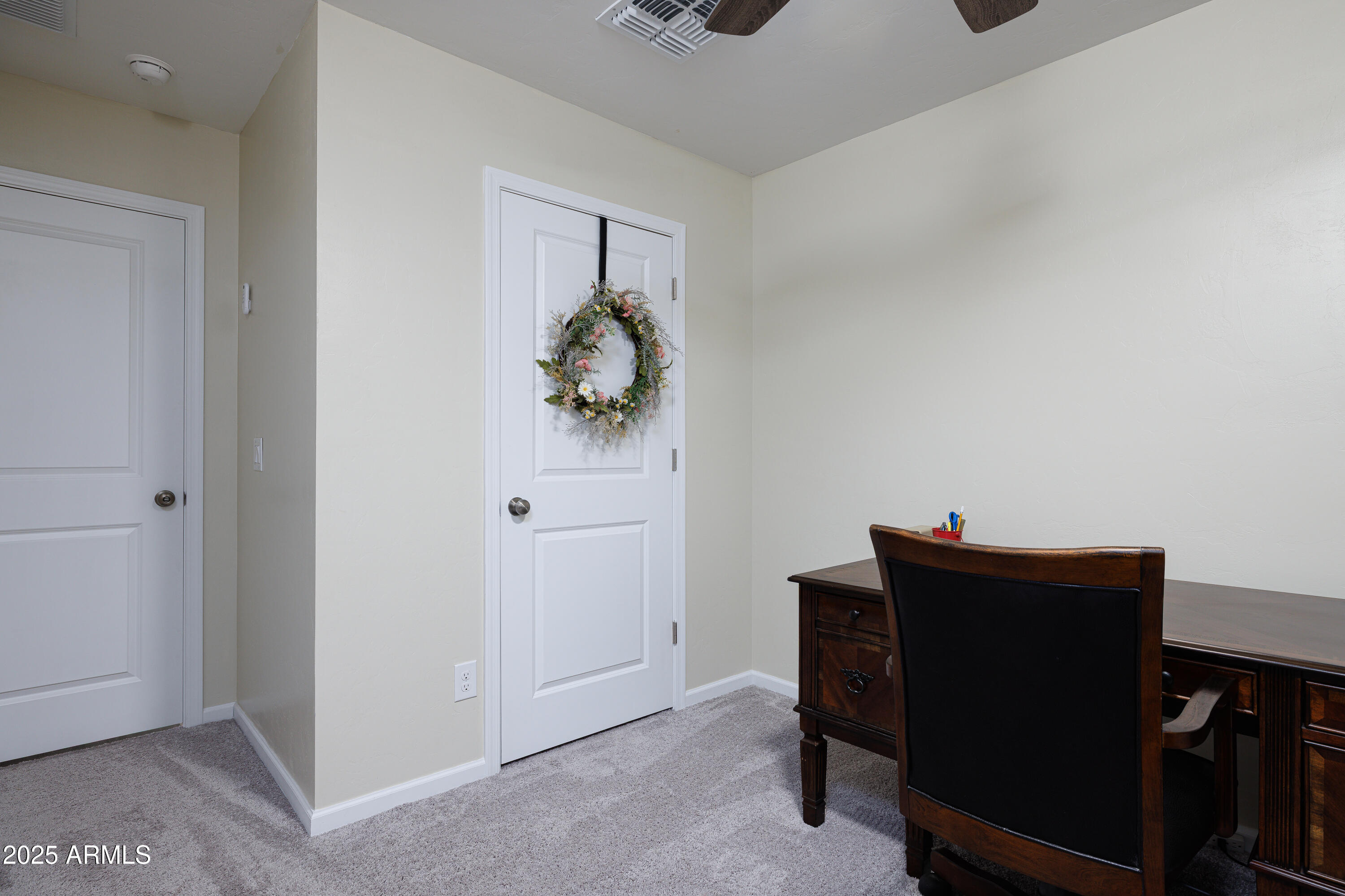 1256 South Lenora Loop Benson, AZ 85602 - Photo 25 of 34 a view of an empty room and wooden floor