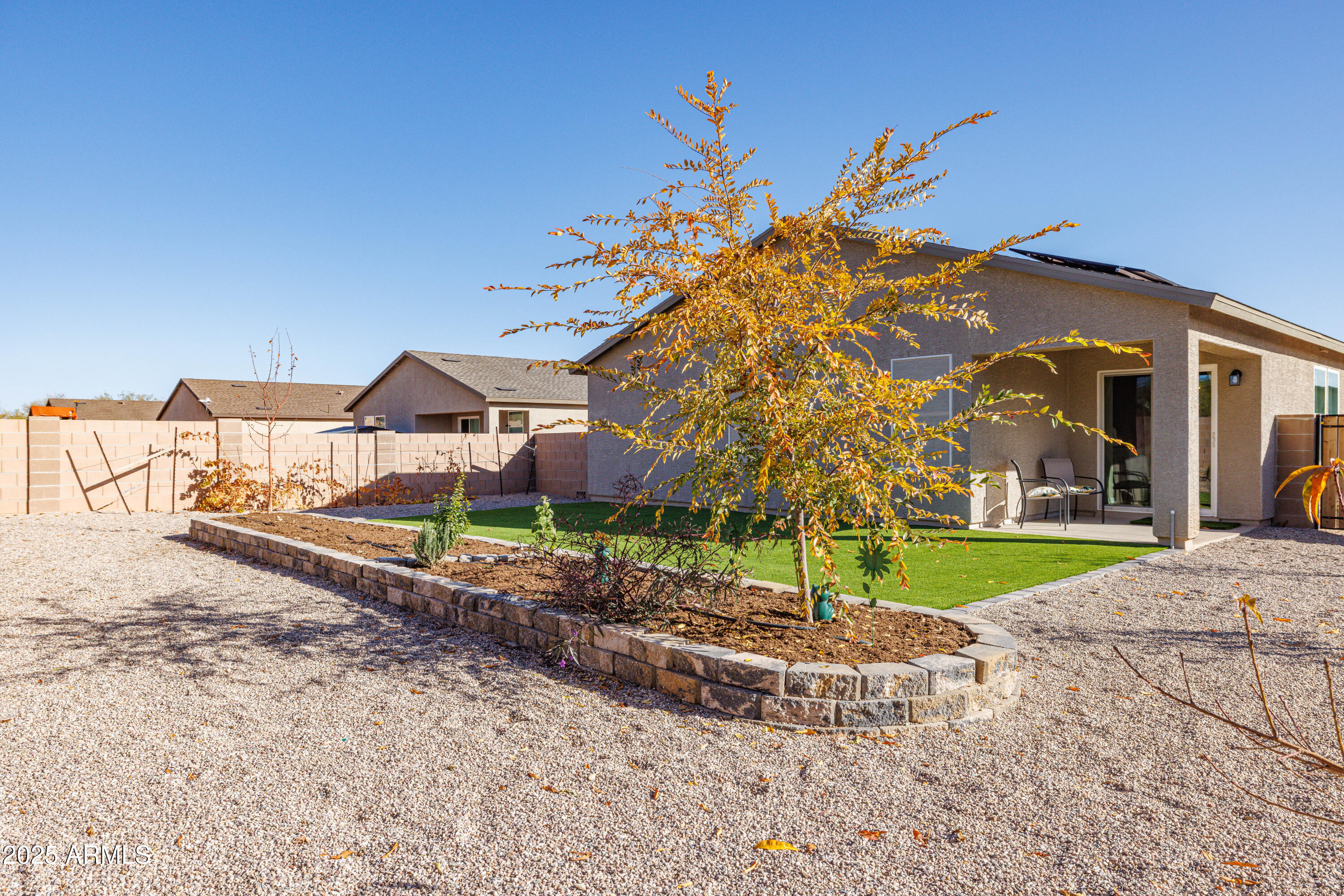 1256 South Lenora Loop Benson, AZ 85602 - Photo 33 of 34 a front view of a house with a yard