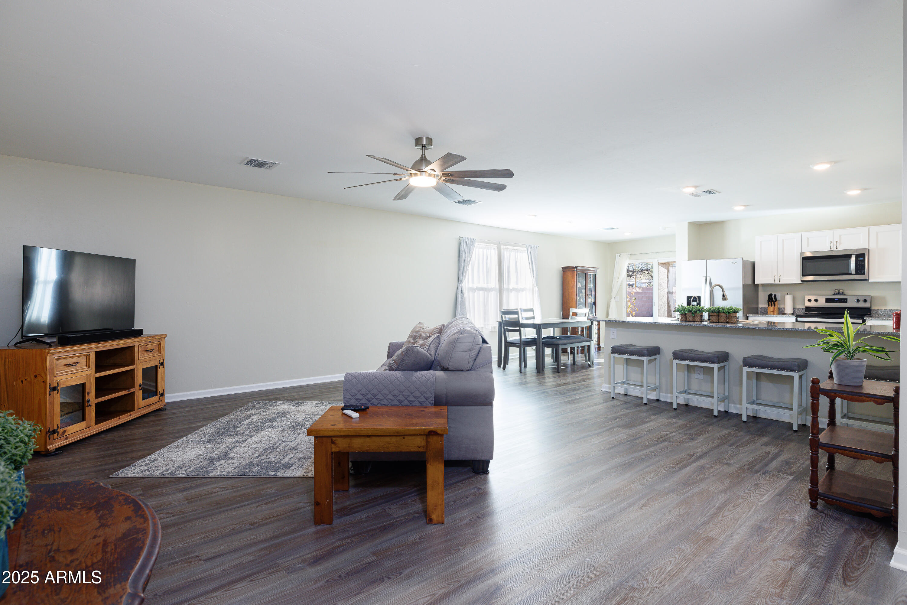 1256 South Lenora Loop Benson, AZ 85602 - Photo 6 of 34 a living room with furniture and a wooden floor