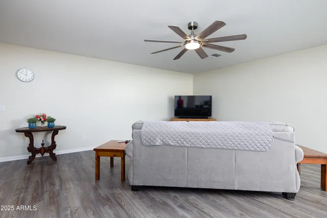 a kitchen with cabinets table and chairs