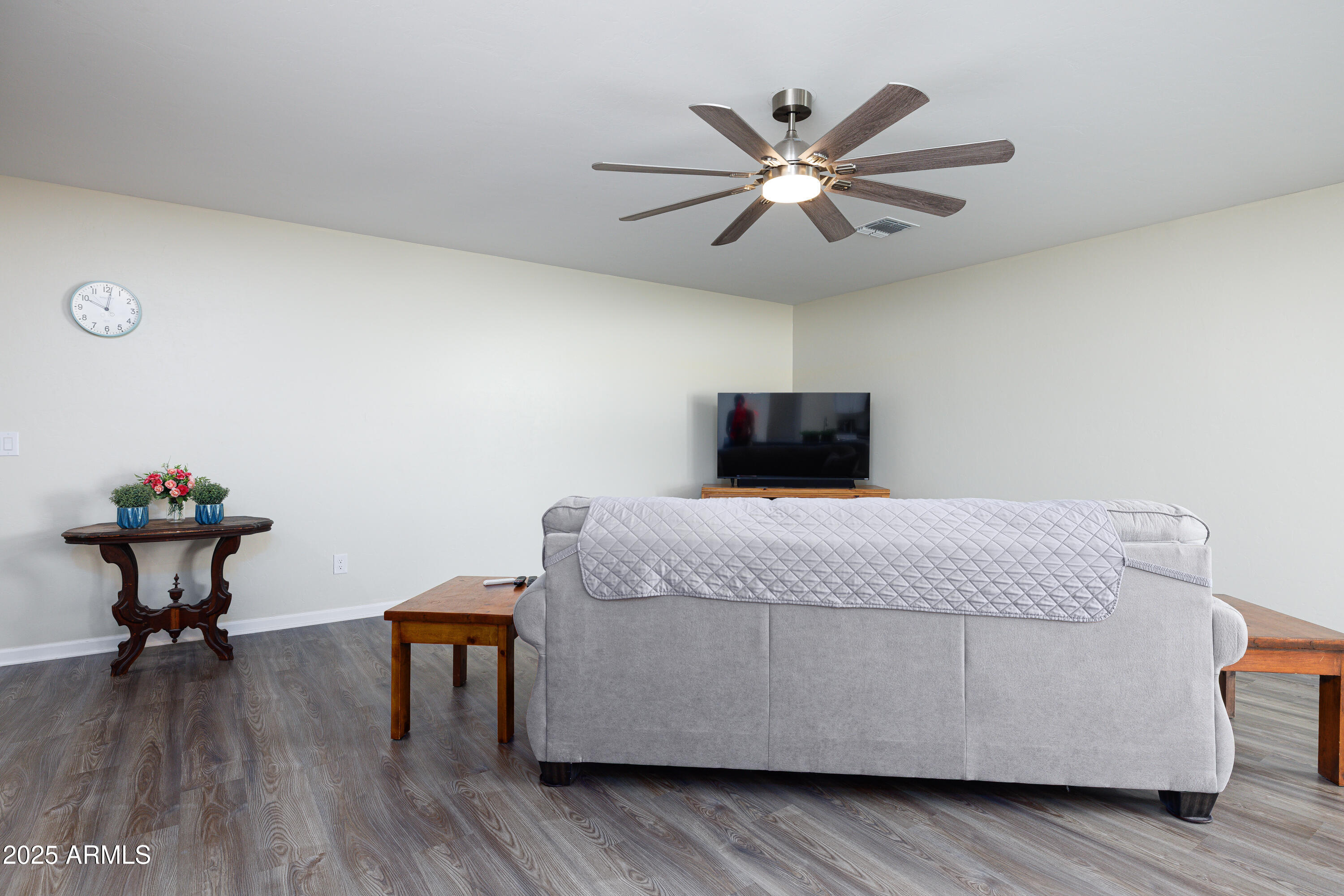 1256 South Lenora Loop Benson, AZ 85602 - Photo 8 of 34 a bedroom with a bed and a chandelier