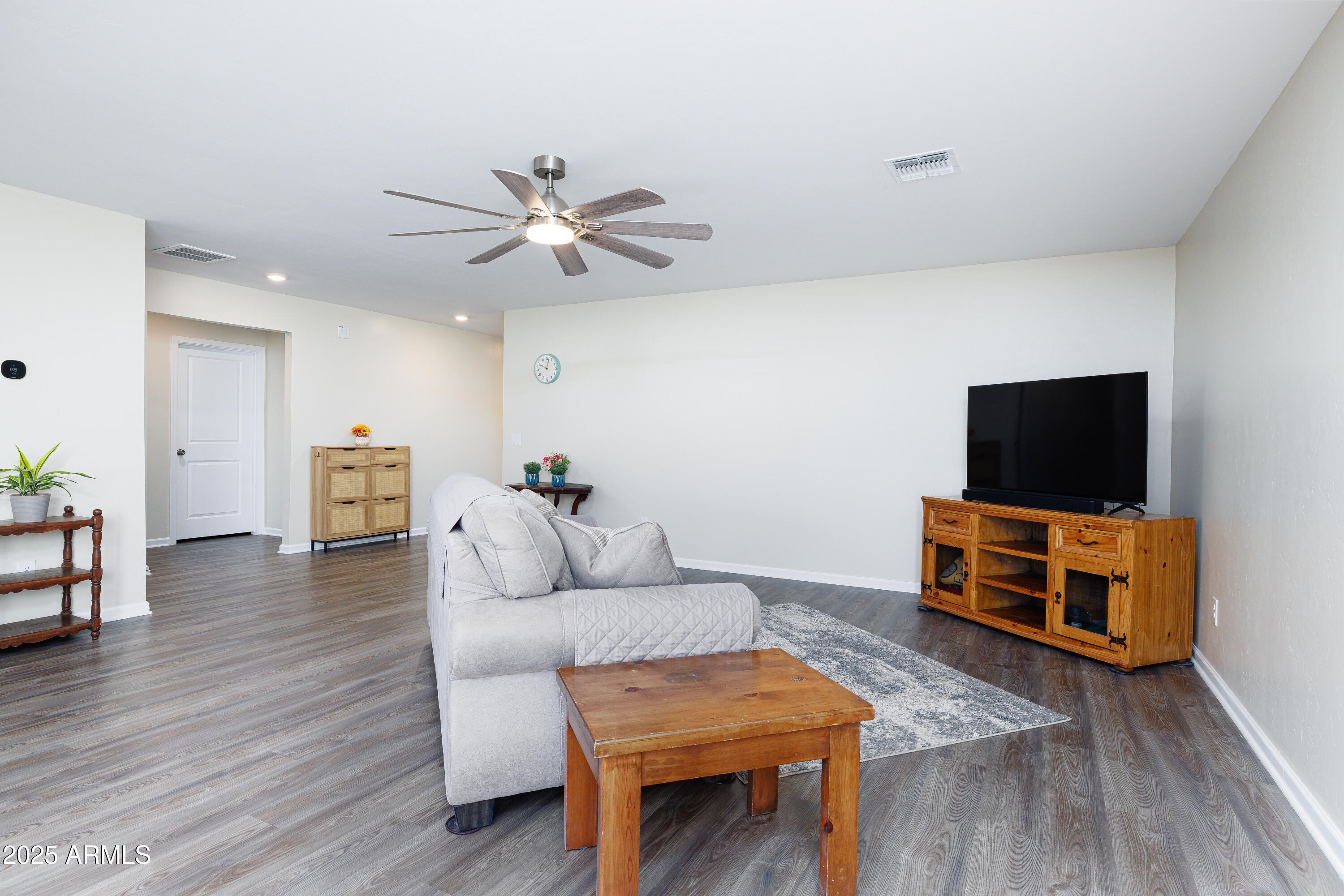 1256 South Lenora Loop Benson, AZ 85602 - Photo 9 of 34 a living room with furniture and a flat screen tv