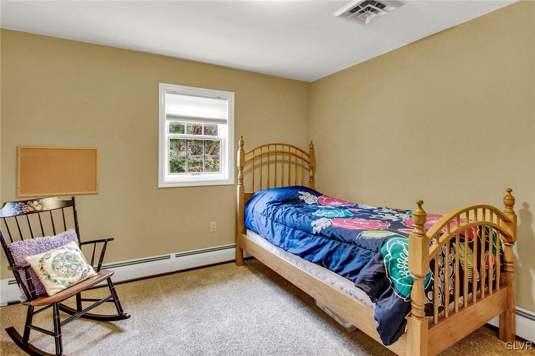 3505 Huckleberry Road Allentown, PA 18104 - Photo 21 of 29 a bedroom with a bed chair and a window