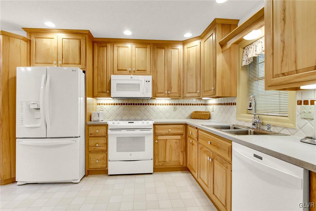 3505 Huckleberry Road Allentown, PA 18104 - Photo 10 of 29 a kitchen with a refrigerator sink and cabinets
