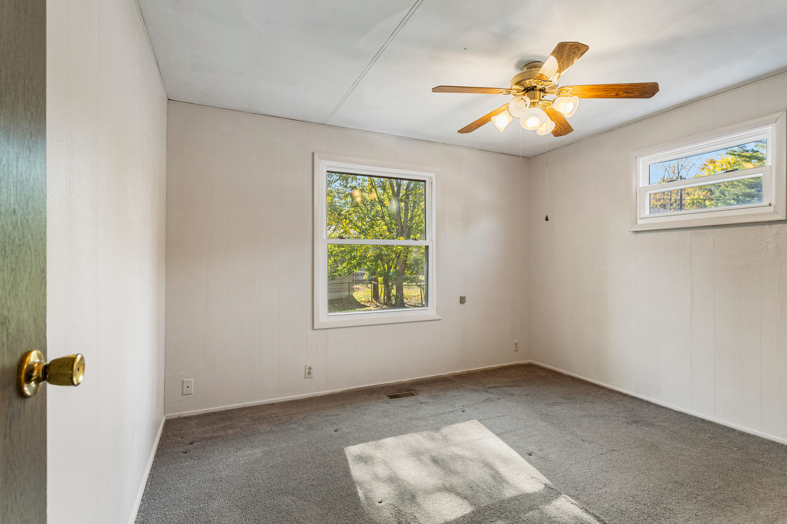 1905 Rainbow View Urbana, IL 61802 - Photo 14 of 20 an empty room with windows and fan