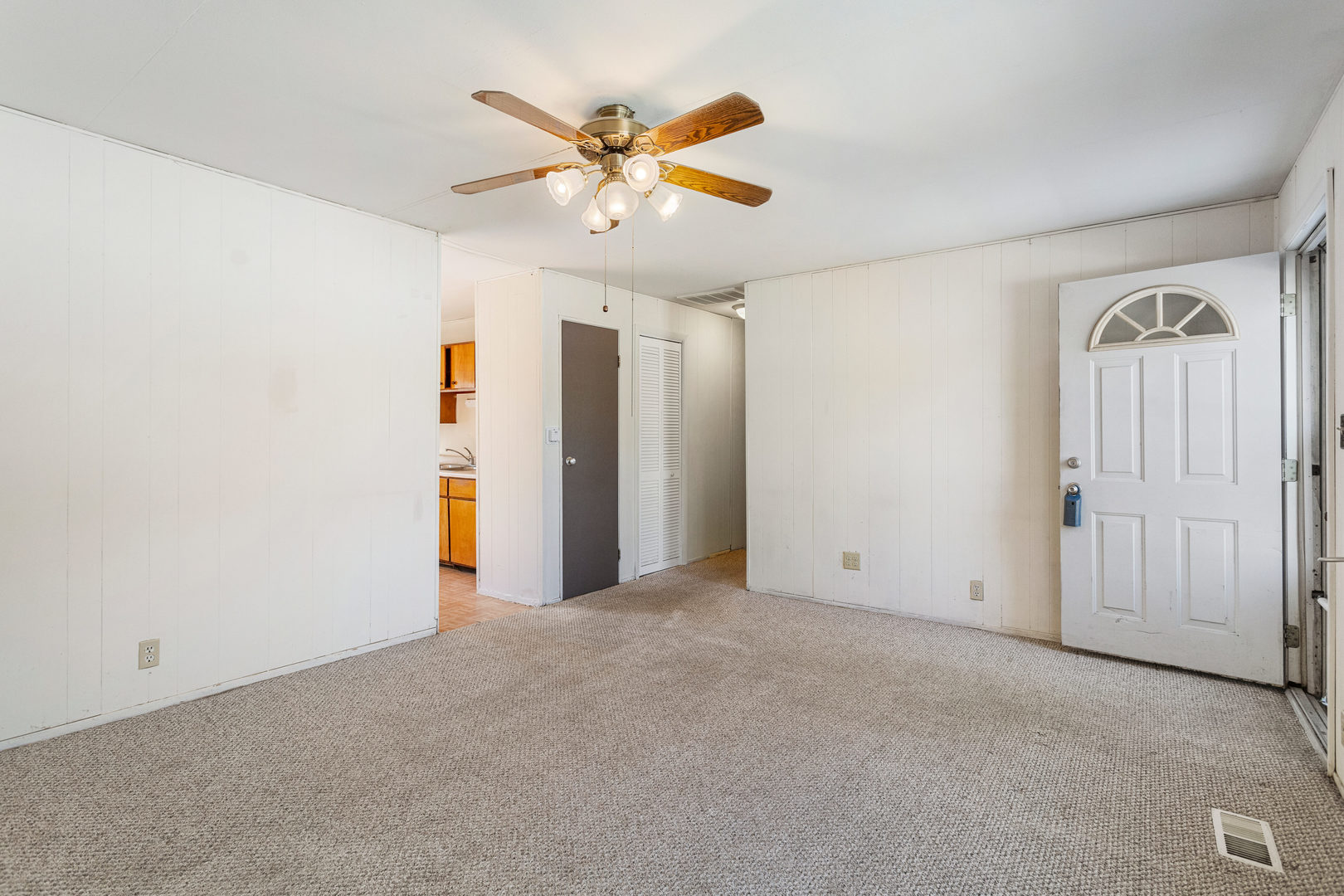 1905 Rainbow View Urbana, IL 61802 - Photo 6 of 20 an empty room with closet and fan