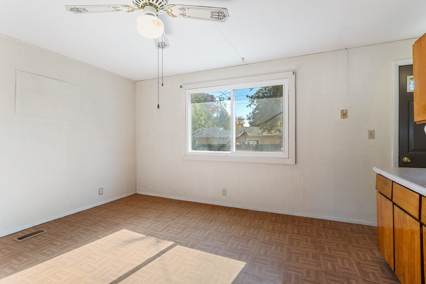 1905 Rainbow View Urbana, IL 61802 - Photo 7 of 20 a view of an empty room with a window