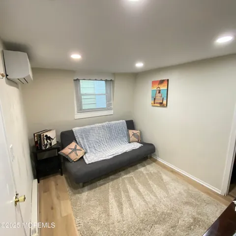 a bedroom with a bed and wall painting