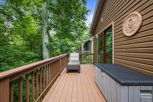 a bathroom with a granite countertop sink a mirror a vanity and shower