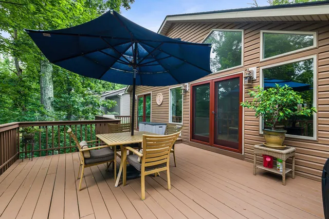 a bath room with a table chairs and a window