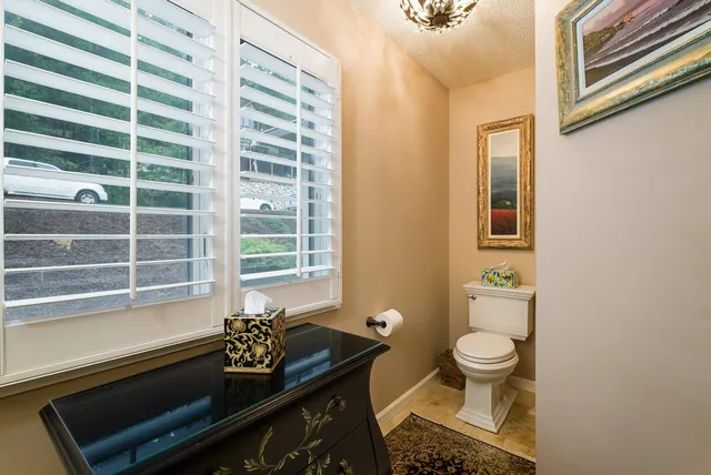 a view of a livingroom with furniture and a fireplace