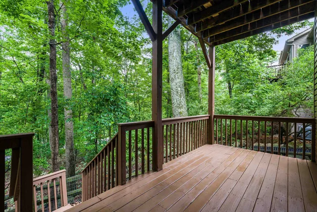a view of a house with a yard and potted plants
