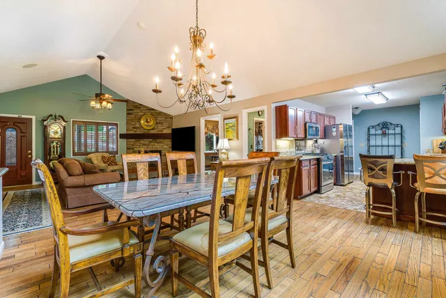 a kitchen with a stove sink and cabinets
