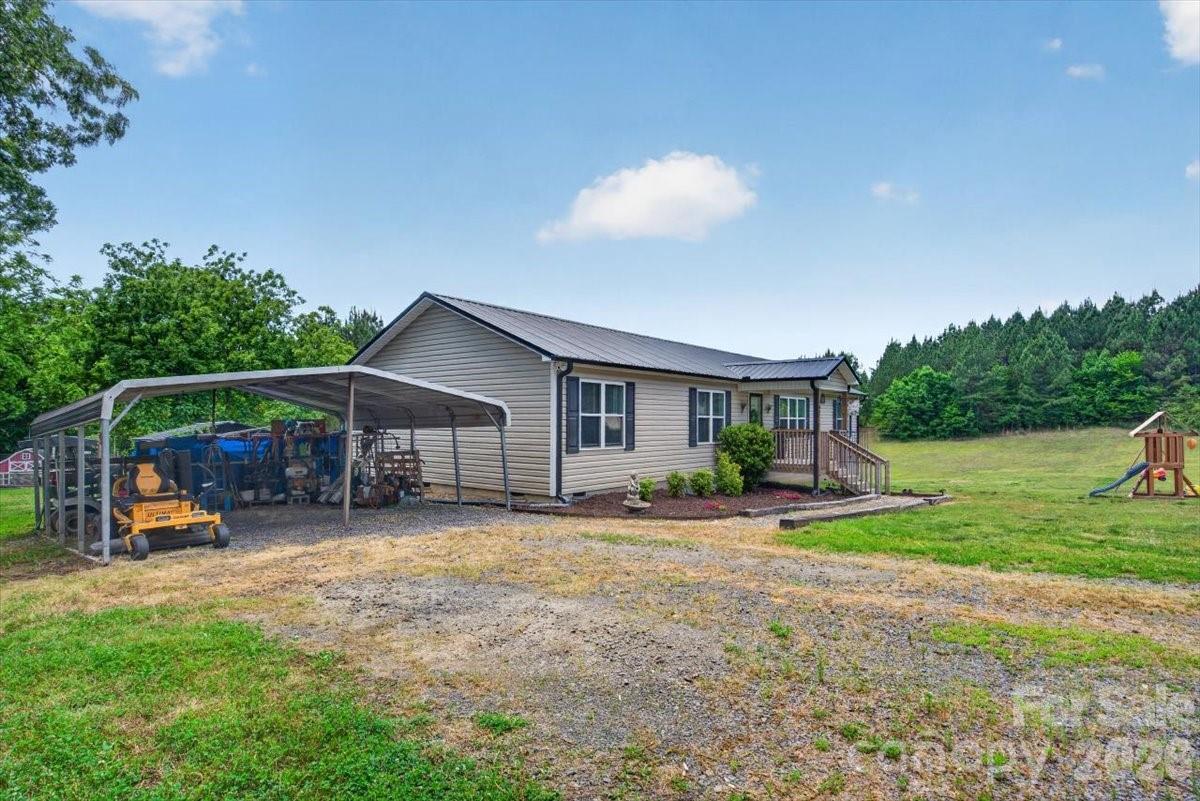 567 Godbey Road Mocksville, NC 27028 - Photo 26 of 38 a view of a house with backyard and sitting area
