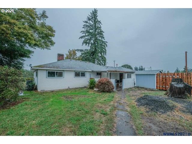34415 Bond Road Lebanon, OR 97355 - Photo 22 of 32 a view of a house with a yard and a fountain