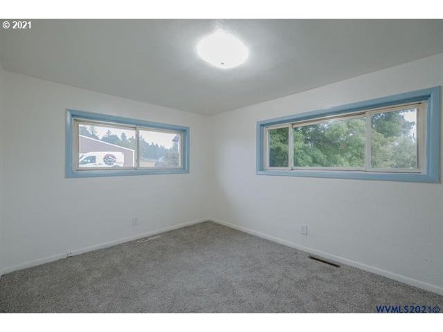 34415 Bond Road Lebanon, OR 97355 - Photo 9 of 32 a view of an empty room with a window