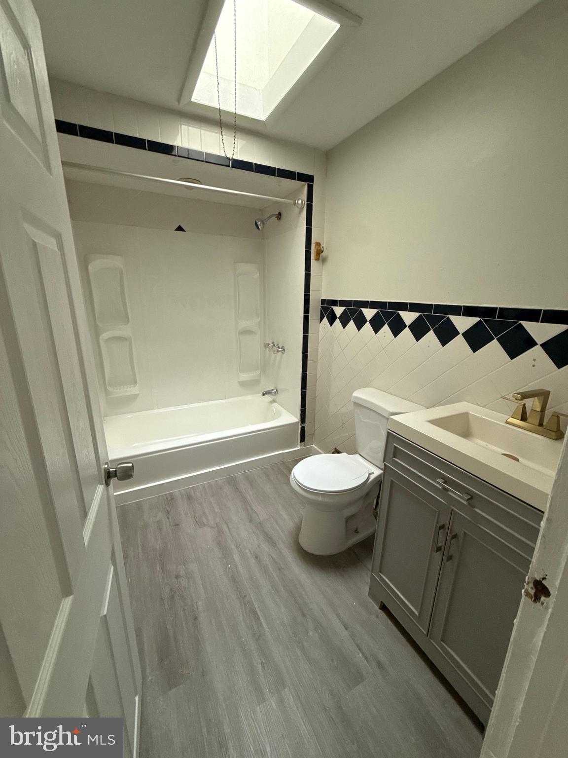 4843 Palethorp Street Philadelphia, PA 19120 - Photo 11 of 16 a bathroom with a bathtub and a toilet