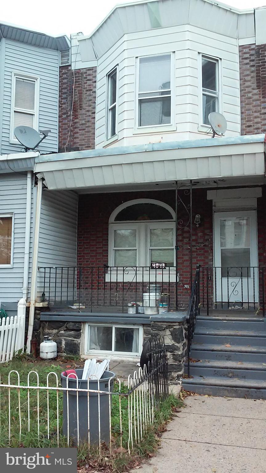 4843 Palethorp Street Philadelphia, PA 19120 - Photo 15 of 16 a front view of house with street