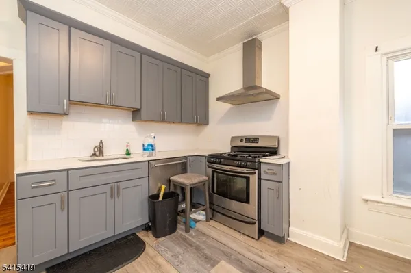 a kitchen with stainless steel appliances granite countertop a stove and a sink