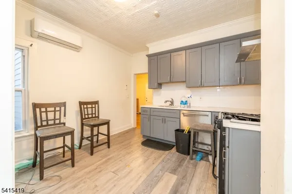 a kitchen with a cabinets and chairs