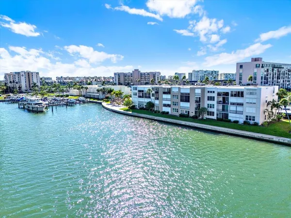 a view of a lake with tall buildings
