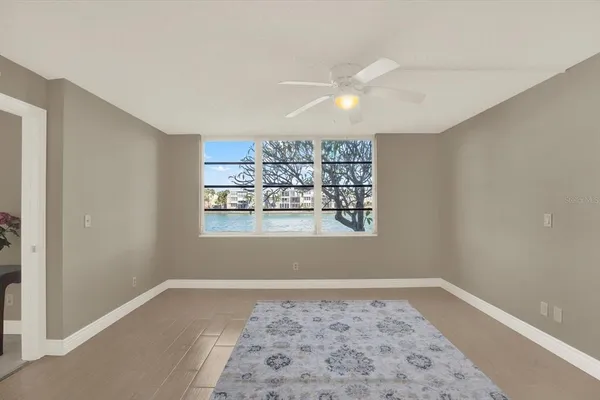 a view of a big room with window and staircase