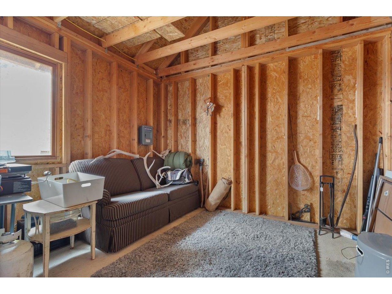 59 Rustic Road Bellvue, CO 80512 - Photo 13 of 21 a living room with furniture and a window