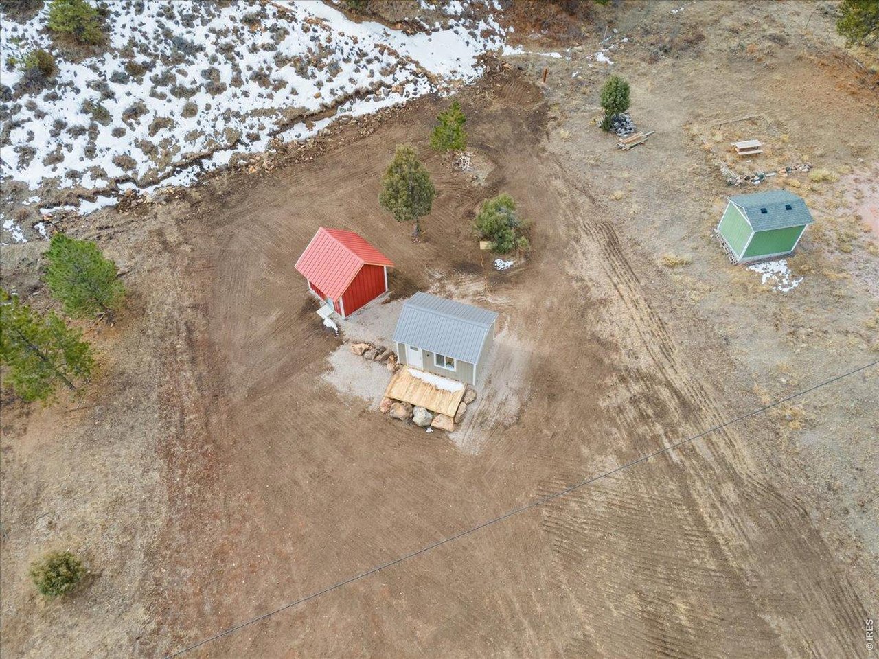 59 Rustic Road Bellvue, CO 80512 - Photo 10 of 21 an aerial view of a house with a yard and wooden fence