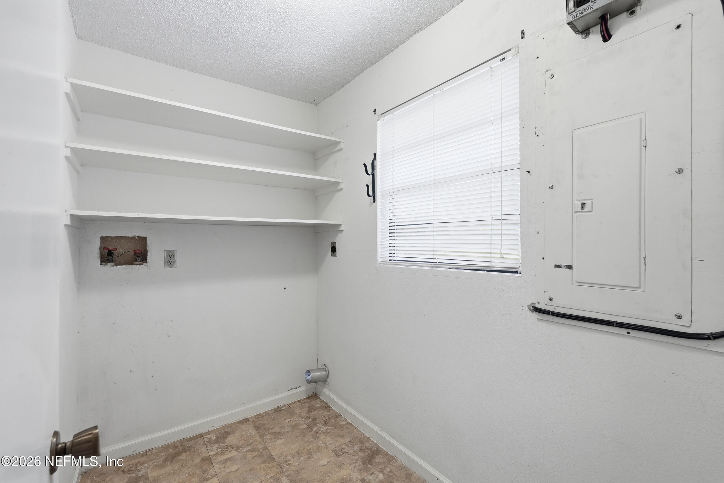 7593 Silver Sands Road Keystone Heights, FL 32656 - Photo 24 of 36 a view of a room with rack on the wall