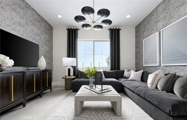 a living room with furniture a large window and a flat screen tv