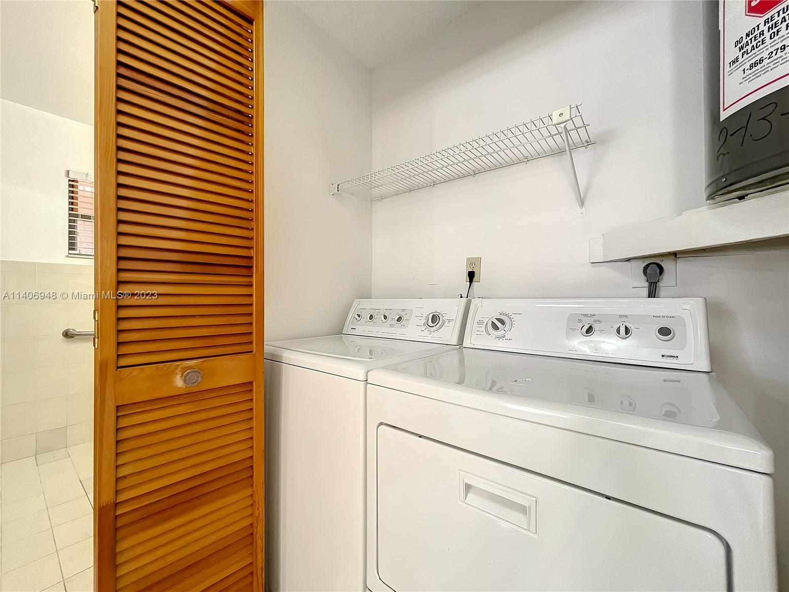 1435 West 40th Street Hialeah, FL 33012 - Photo 4 of 19 a utility room with dryer and washer