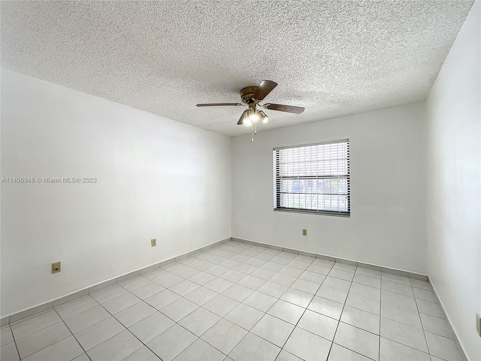 1435 West 40th Street Hialeah, FL 33012 - Photo 6 of 19 a view of an empty room with a window