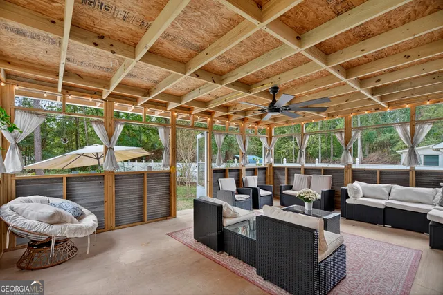 a view of a couches and table in the patio