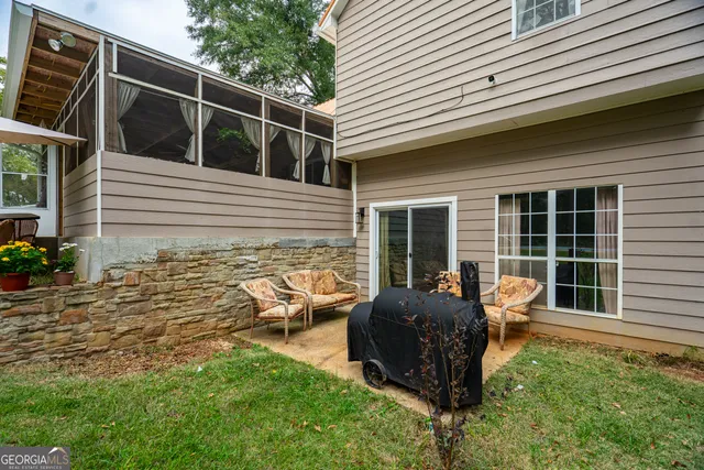 a view of backyard with seating space and porch