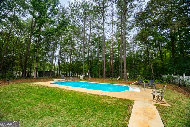 a view of a park with large trees