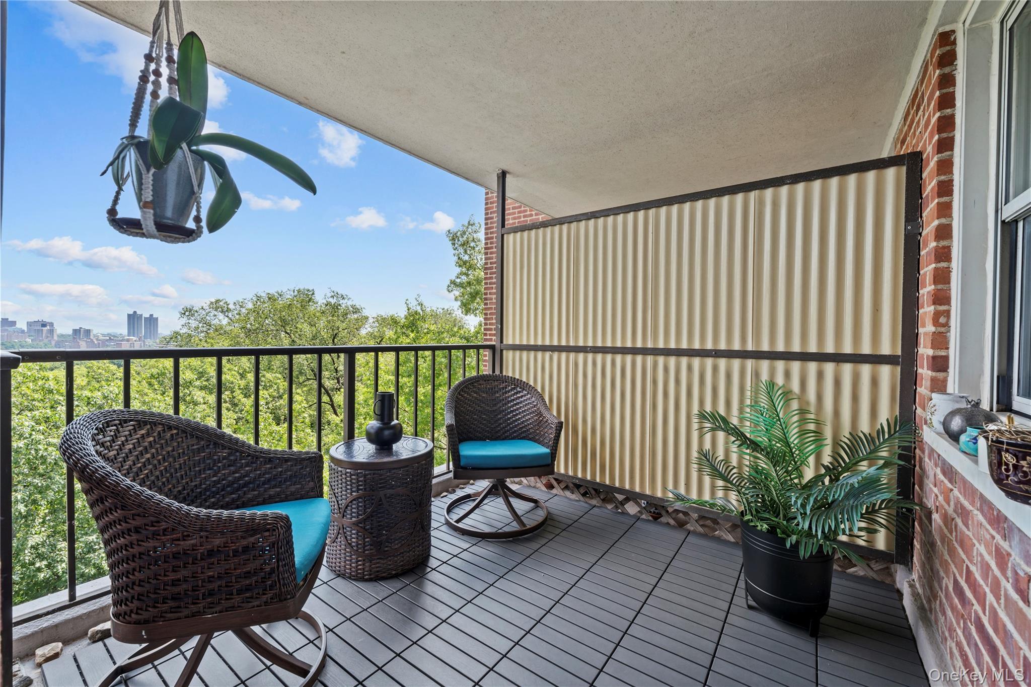 a view of balcony with chair and potted plant