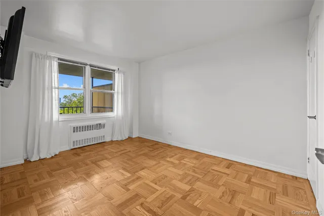a view of an empty room with a window
